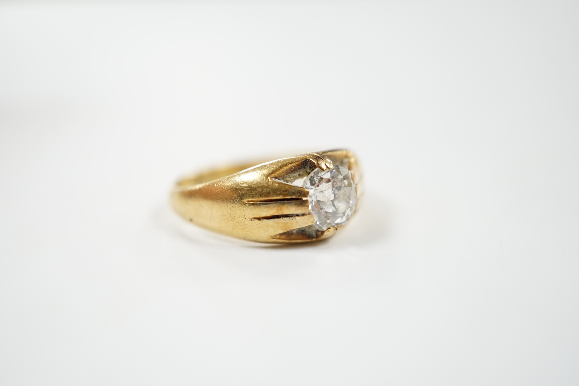 A late Victorian 18ct gold and claw set solitaire diamond ring, size P, gross weight 6.1 grams